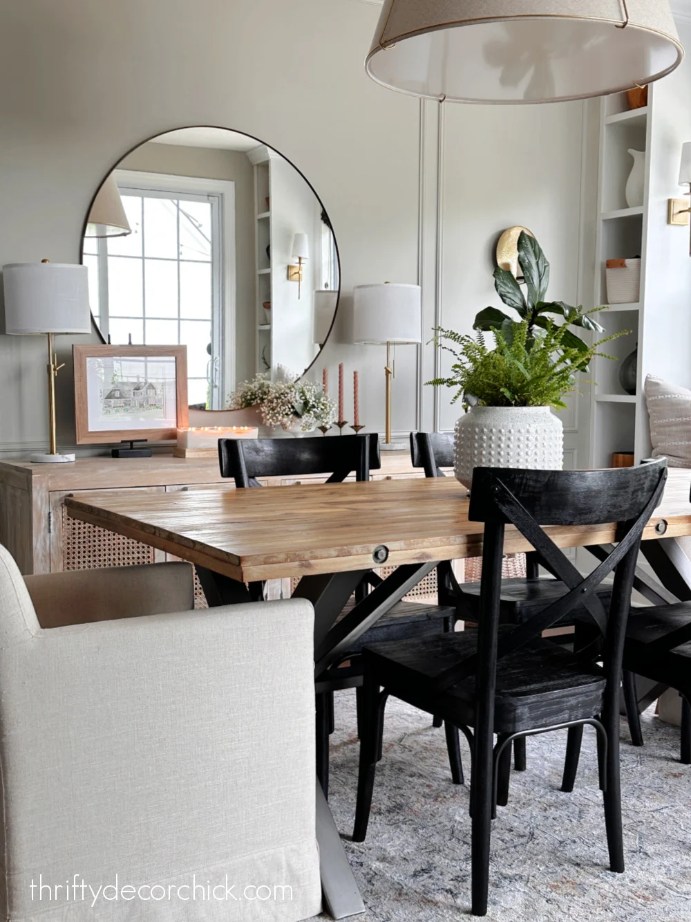 wood planked table black chairs